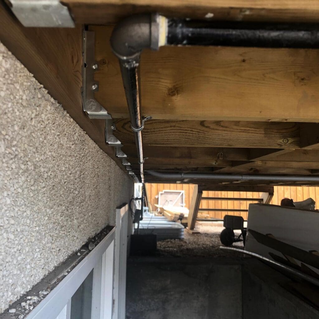 gas line installation for a natural gas bbq under deck view in Edmonton AB