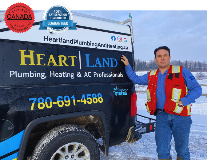 owner-of-heartland-plumbing-and-heating-ltd-michael-kuchmak-known-as-jaxon owner of heartland plumbing and heating ltd by his work truck, red seal badge and 100% satisfaction guarantee badge
